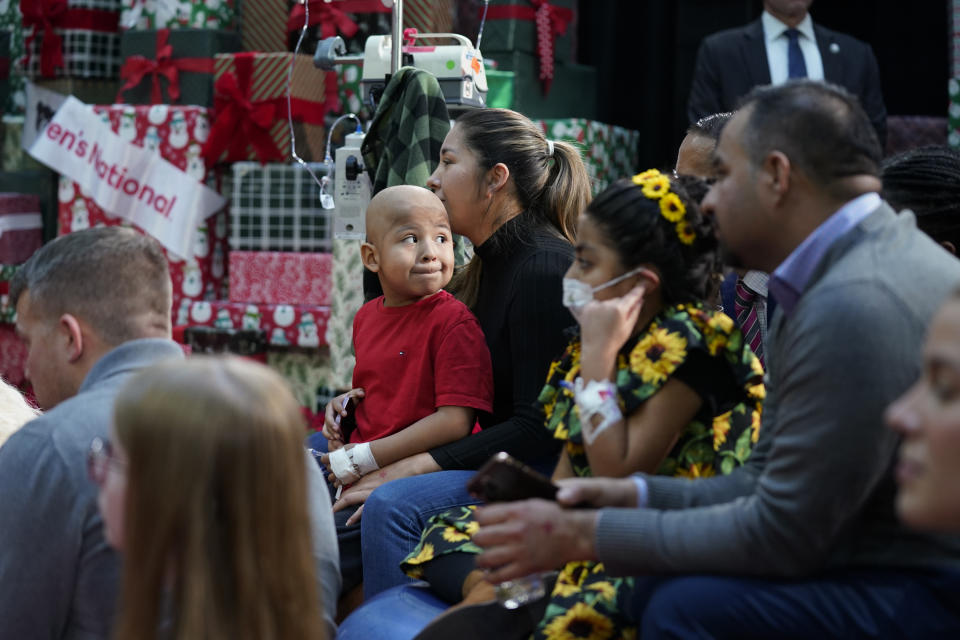 Children listen as first lady Jill Biden reads "Twas the Night Before Christmas" at Children's National Hospital, Friday, Dec. 22, 2023, in Washington. (AP Photo/Evan Vucci)