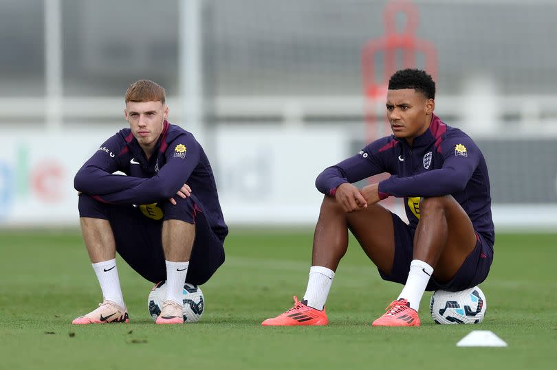 Cole Palmer and Ollie Watkins of England look on during a training session at St Georges Park on October 08, 2024