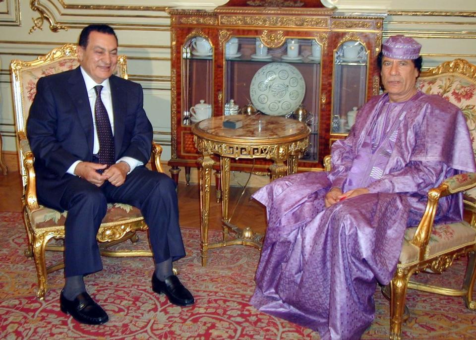 Perhaps inspired by the artist formally known as Prince, Gaddafi goes for on-trend colour blocking, keeping it lilac from head to toe. A striking look that leaves his fellow statesman looking square and sartorially unimaginative.     Gaddafi poses with Egyptian President Hosni Mubarak, during celebration of the 50th anniversary of the Egypt revolution in Cairo in 2002