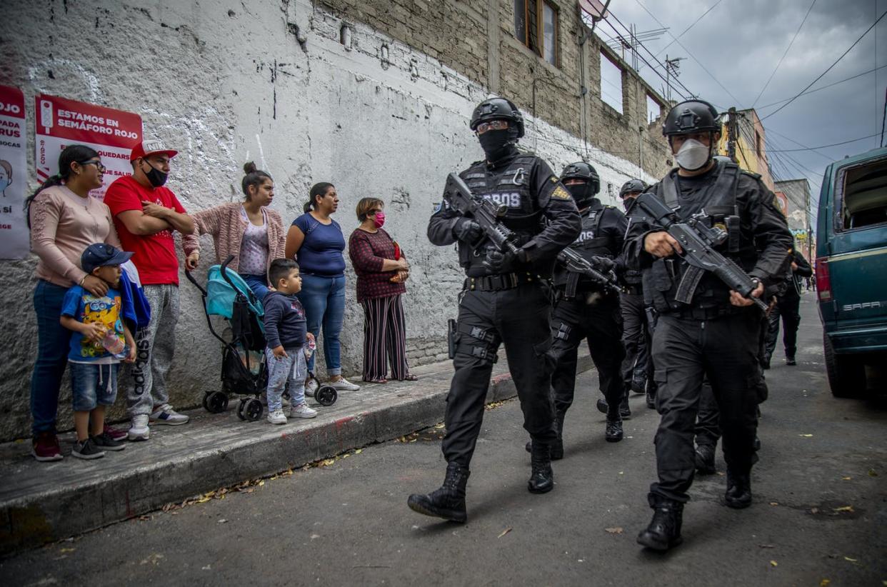 <span class="caption">Mexico's militarized war on drugs – and, often, drug users – has killed at least 150,000 people over the past 15 years.</span> <span class="attribution"><a class="link " href="https://www.gettyimages.com/detail/news-photo/june-2020-mexico-mexiko-stadt-women-and-children-look-at-news-photo/1229949132?adppopup=true" rel="nofollow noopener" target="_blank" data-ylk="slk:Jair Cabrera Torres/picture alliance via Getty Images;elm:context_link;itc:0;sec:content-canvas">Jair Cabrera Torres/picture alliance via Getty Images</a></span>