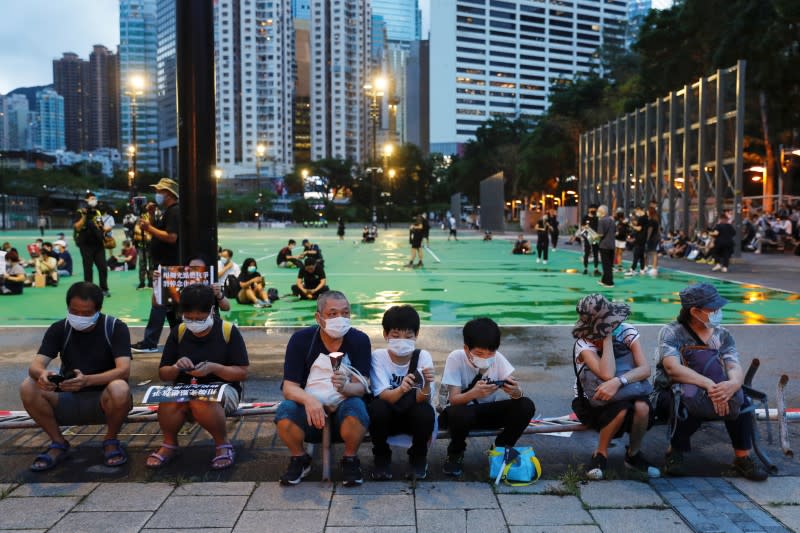 Protesters take part in a candlelight vigil to mark the 31st anniversary of the crackdown of pro-democracy protests at Beijing's Tiananmen Square in 1989, in Hong Kong