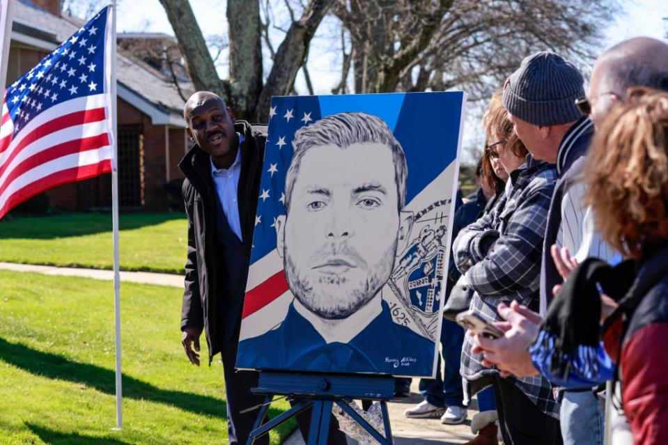 People are seen in attendance for NYPD officer Jonathan Diller at St. Rose of Lima Church in Massapequa following his death. Daniel S. Krieger / SplashNews.com