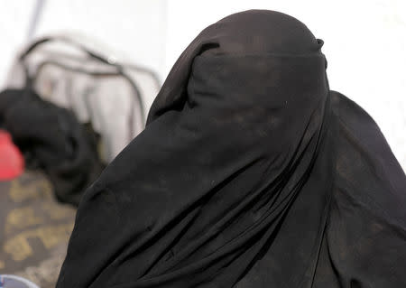 An Algerian woman in a full face veil, who joined the Islamic State in Syria four years ago, is seen near the village of Baghouz, Deir Al Zor province, Syria February 26, 2019. REUTERS/Rodi Said