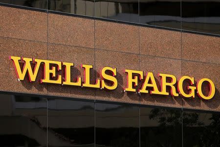 The logo on a Wells Fargo bank building is seen in downtown San Diego, California March 18, 2014. REUTERS/Mike Blake