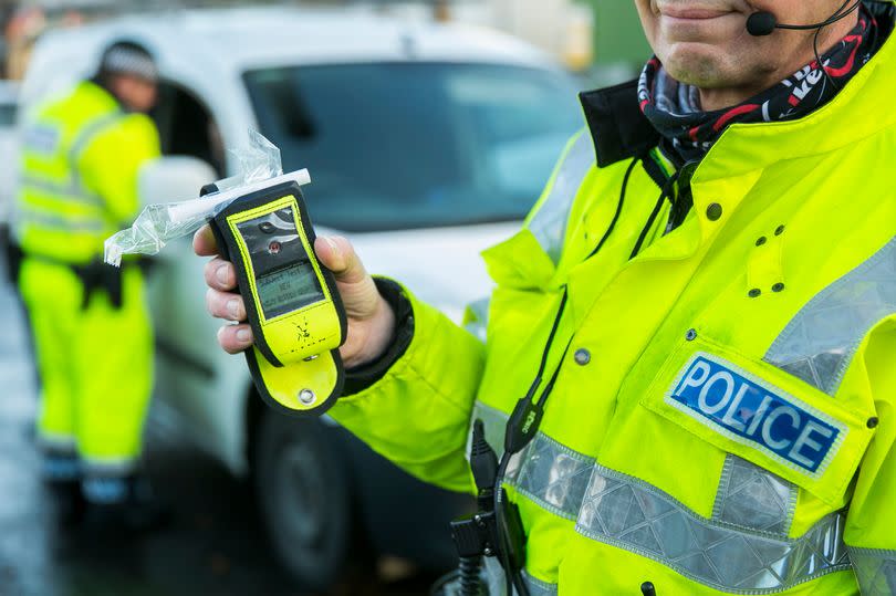 File picture of police with a breathalyzer device -Credit:PA Archive/PA Images