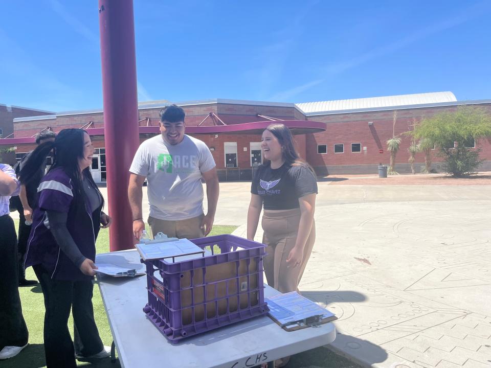 Students in Cesar Chavez High School's M.E.Ch.A organization are registering classmates to vote. From left: Cesar Chavez student Brianna Lomas, Arizona Center for Empowerment organizer Ozzie Garcia and Cesar Chavez student Jocelyn Montiel at Cesar Chavez on May 1, 2024.