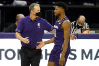 Northwestern head coach Chris Collins, left, celebrates with guard Anthony Gaines during the second half of an NCAA college basketball game against Chicago State in Evanston, Ill., Saturday, Dec. 5, 2020. Northwestern won 111-66. (AP Photo/Nam Y. Huh)