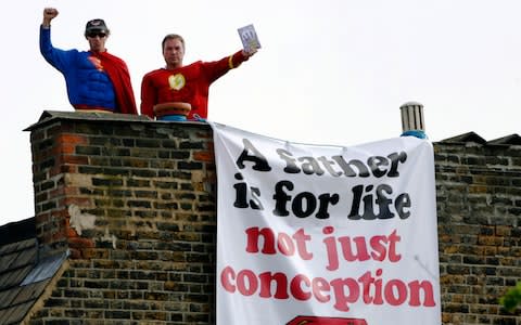 Campaigners from Fathers 4 Justice stand on the roof of the home of former Labour Party deputy leader, Harriet Harman - Credit: REUTERS/Luke MacGregor