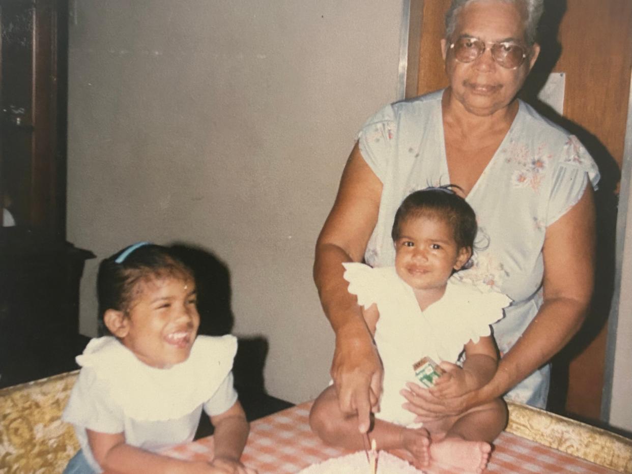 Grandma with two granddaughters celebrating birthday