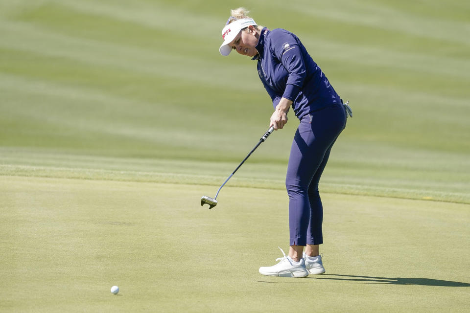 Nanna Koerstz Madsen watches her putt on the ninth hole during the final round of the Drive On Championship golf tournament, Sunday, March 26, 2023, in Gold Canyon, Ariz. (AP Photo/Darryl Webb)