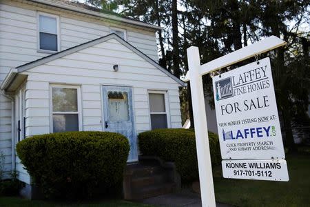 A 'for sale' is seen outside a single family house in Garden City, New York, U.S., May 23, 2016. REUTERS/Shannon Stapleton/File Photo