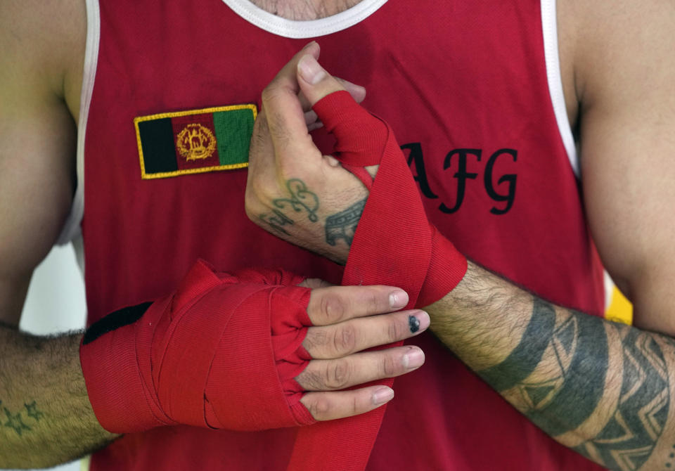 A member of the Afghan national boxing team trains during a session in local gym in Serbia, Wednesday, Dec. 1, 2021. They practiced in secrecy and sneaked out of Afghanistan to be able to compete at an international championship. Now, the Afghan boxing team are seeking refuge in the West to be able to continue both their careers and lives without danger or fear. (AP Photo/Darko Vojinovic)