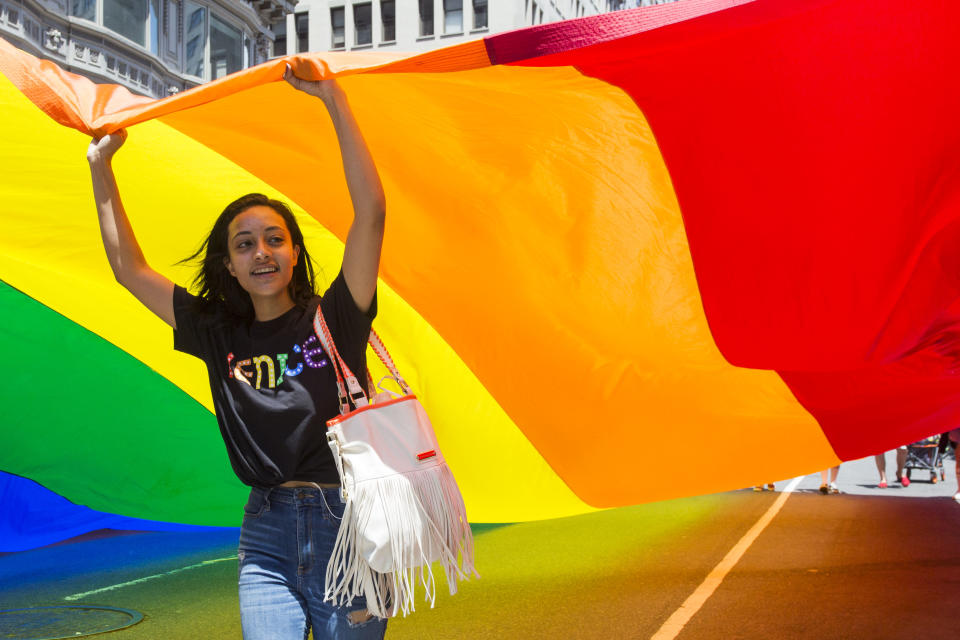 A parade goer holds a giant rainbow flag at the annual Pride Parade on Sunday, June 29, 2019 in New York, NY. This years annual Pride Parade celebrates the 50th Anniversary of the Stonewall Uprising and a half-century of LGBTQ+ liberation. (Photo by Erin Lefevre/NurPhoto via Getty Images)