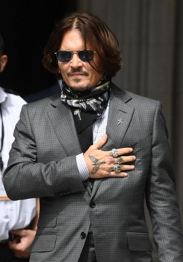 Johnny Depp looks almost unrecognisable as he shaves off trademark ...