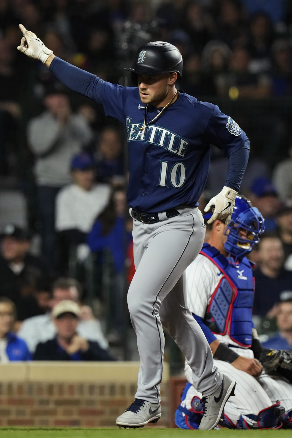 Seattle Mariners' Jarred Kelenic celebrates after hitting a solo home run during the ninth inning of a baseball game against the Chicago Cubs in Chicago, Monday, April 10, 2023. (AP Photo/Nam Y. Huh)