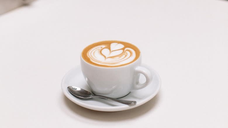 cup of coffee on white table