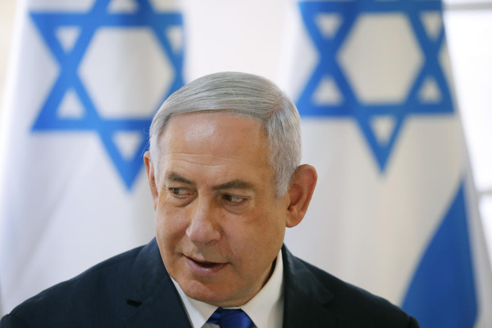 Israeli Prime Minister Benjamin Netanyahu chairs during the weekly cabinet meeting being held in the Jordan Valley, in the Israeli-occupied West Bank, Sunday, Sept. 15, 2019. Netanyahu convened his final pre-election cabinet meeting in a part of the West Bank that he's vowed to annex if re-elected. National elections are on Tuesday. (Amir Cohen/Pool via AP)