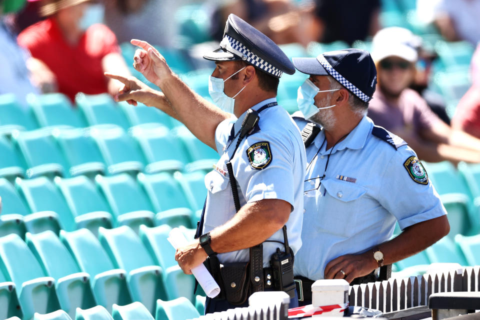SYDNEY, AUSTRALIA - JANUARY 10: Police monitor the crowd following a complaint by Mohammed Siraj of India about spectators during day four of the Third Test match in the series between Australia and India at Sydney Cricket Ground on January 10, 2021 in Sydney, Australia. (Photo by Cameron Spencer/Getty Images)