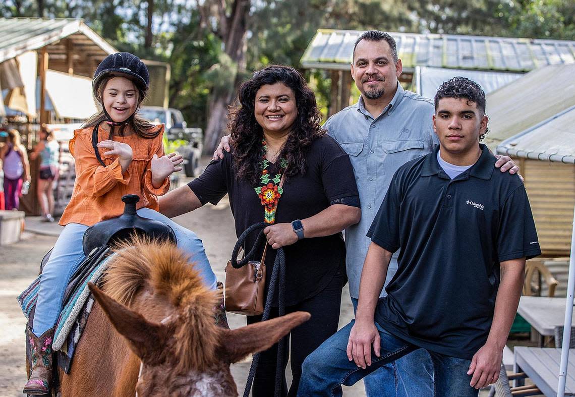 Angelina Lopez posed with her parents Glenda and Ronnie Lopez and brother Nicholas Lopez, as she rides a horse at HAPPI Farm.