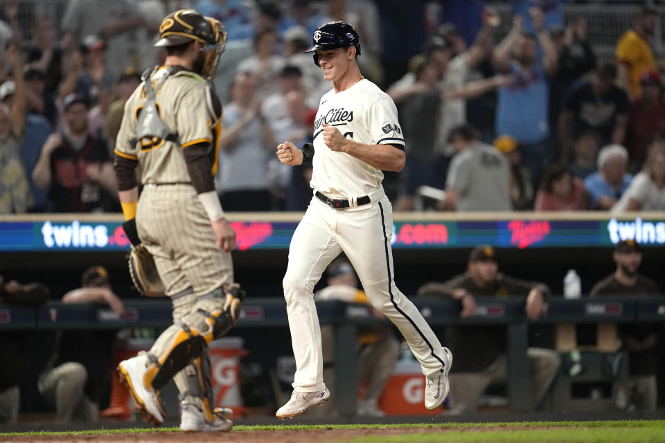 Minnesota Twins' Max Kepler celebrates while crossing home plate to score the game-winning run against the San Diego Padres during the 11th inning of a baseball game Wednesday, May 10, 2023, in Minneapolis. (AP Photo/Abbie Parr)