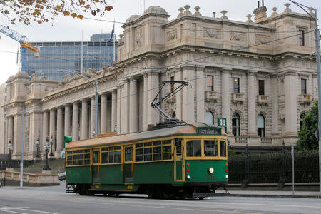 FILE PHOTO: A vintage Melbourne tram passes by Victoria's Parliament Building in Melbourne, Australia, June 13, 2017. REUTERS/Jason Reed/File Photo