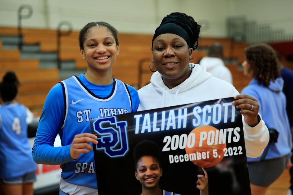 St. Johns Country Day's Taliah Scott (2) poses with head coach Yolanda Bronston after Monday's game.