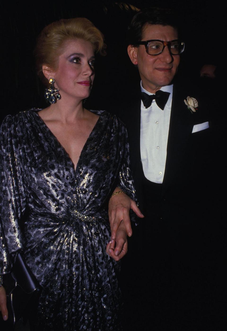 Catherine Deneuve and Yves Saint Laurent at the Oscars. (Getty Images)