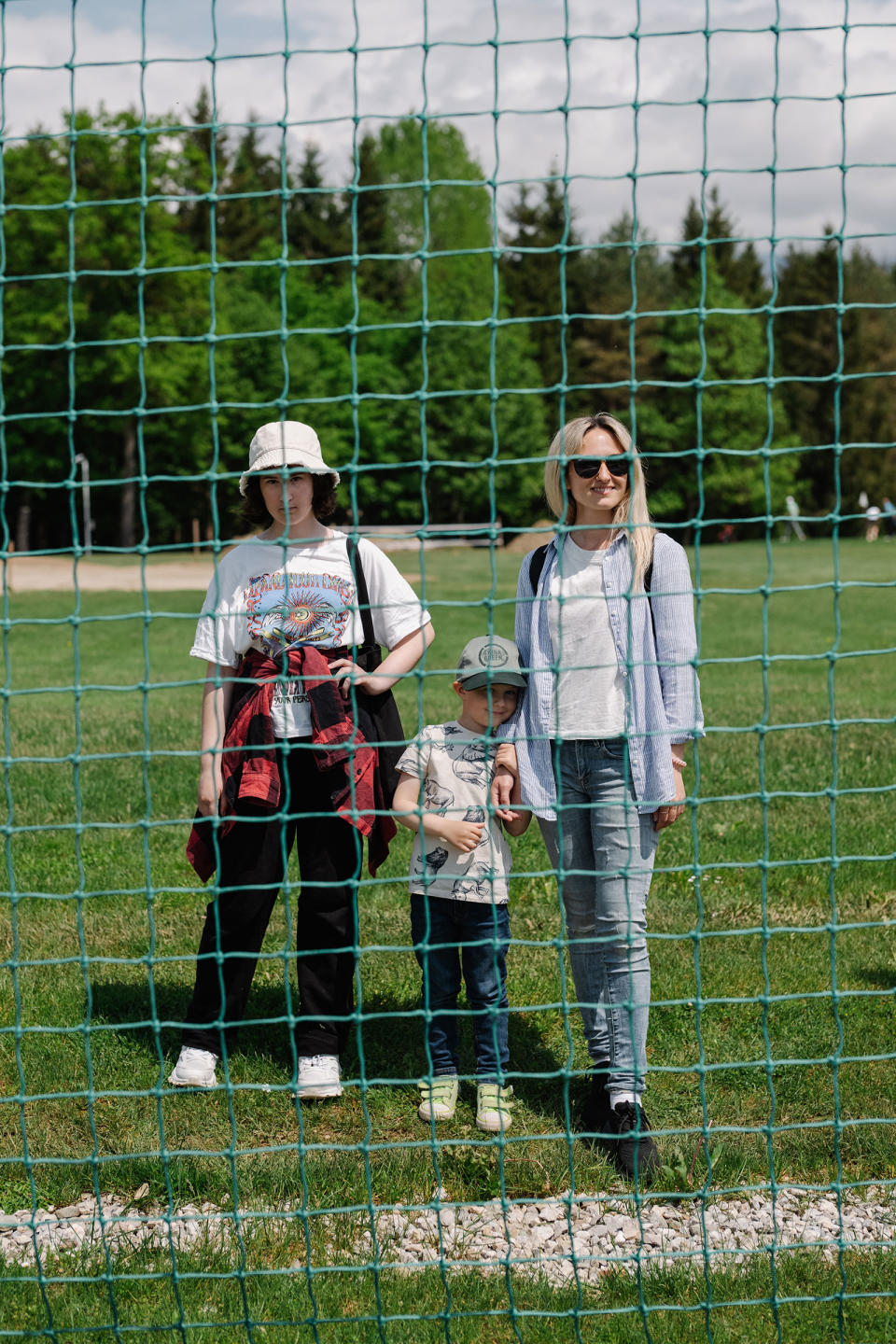 Kseniia Nikitina, from the Ukrainian city of Zhytomyr, watches the team train, along with her 12-year-old daughter Alisa, and 4-year-old son Martin<span class="copyright">Ciril Jazbec for TIME</span>