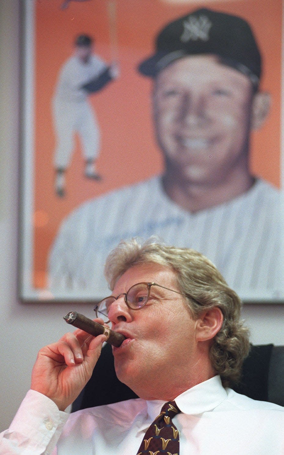 May 1997: Talk show host Jerry Springer draws on a cigar in his Chicago office while working on a final draft of his first commentary. Springer's office is also a makeshift shrine to Mickey Mantle, his idol as a kid. Springer is in the center of controversy follwing his hiring to do commentary on the Chicago NBC station. 
The Enquirer/Michael E. Keating