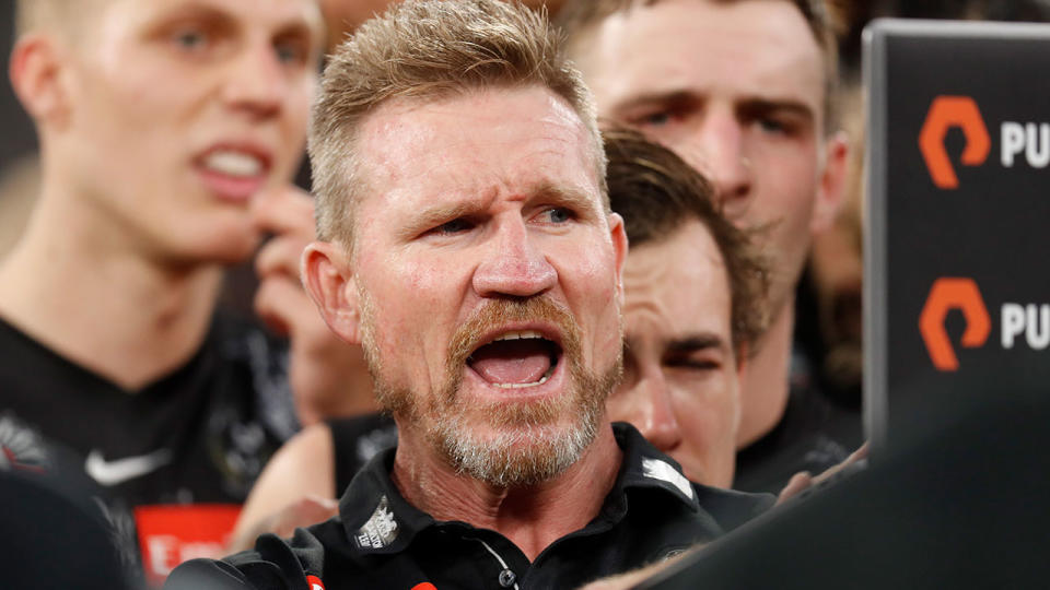 Pictured here, Collingwood Nathan Buckley gives a passionate address to his players.