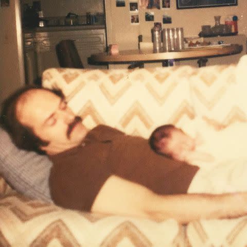 <p>Courtesy of J. Dana Trent</p> J. Dana Trent sleeping on her dad's chest as a baby