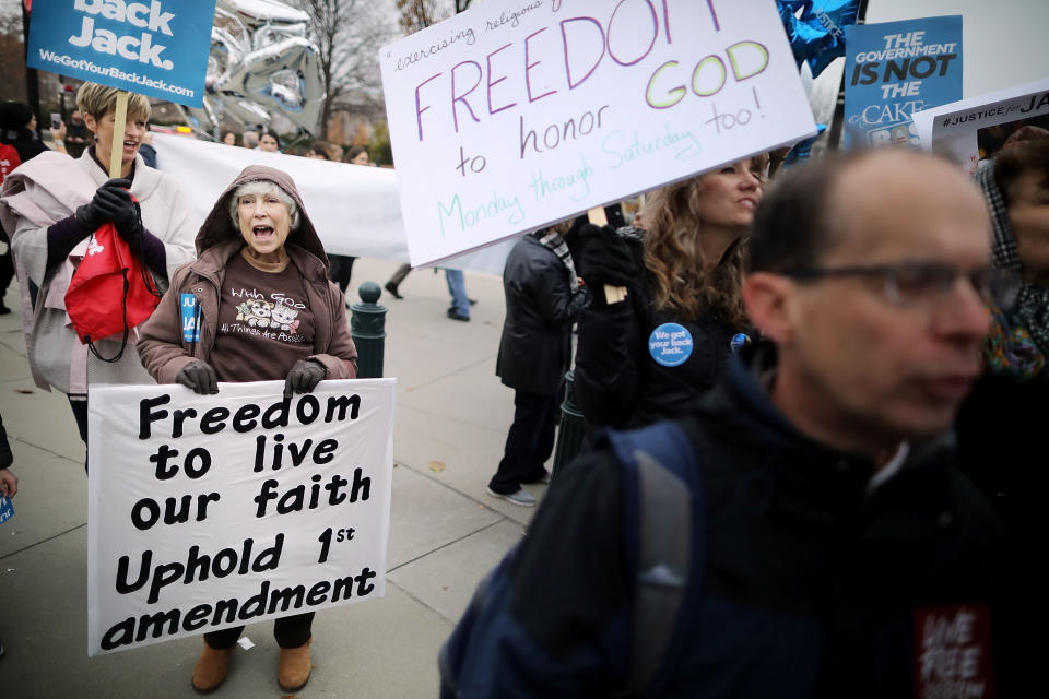 <p>Protesters gather in front of the Supreme Court building on the day the court is to hear the case Masterpiece Cakeshop v. Colorado Civil Rights Commission, Dec. 5, 2017 in Washington. (Photo: Chip Somodevilla/Getty Images) </p>