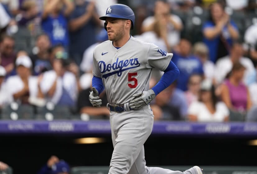 Los Angeles Dodgers' Freddie Freeman runs the bases after hitting a solo home run off Colorado Rockies starting pitcher German Marquez during the first inning of a baseball game Wednesday, June 29, 2022, in Denver. (AP Photo/David Zalubowski)