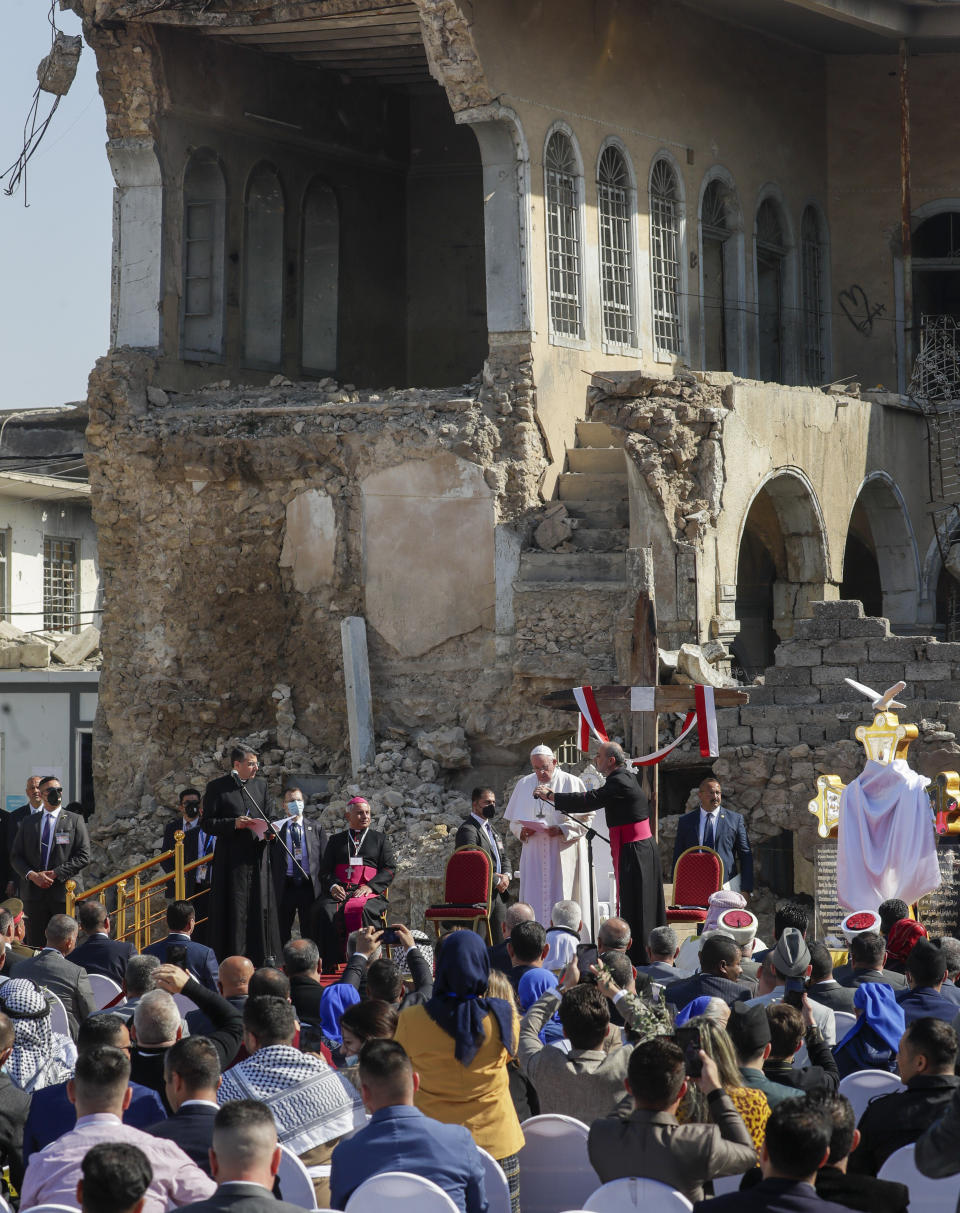 FILE - Pope Francis, surrounded by shells of destroyed churches, leads a prayer for the victims of war at Hosh al-Bieaa Church Square, in Mosul, Iraq, March 7, 2021. Pope Francis is celebrating his 85th birthday Friday, Dec17, 2021, a milestone made even more remarkable given the coronavirus pandemic, his summertime intestinal surgery and the weight of history: His predecessor retired at this age and the last pope to have lived any longer was Leo XIII over a century ago. (AP Photo/Andrew Medichini, file)