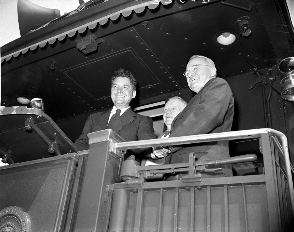 FILE - A group of Ohio democratic leaders greet President Truman when his train stopped briefly at Crestline, Ohio, June 4, 1948. Standing with Truman is Former Gov. Frank J. Lausche, right, and Albert A. Horstman, former democratic chairman. (AP Photo, File)