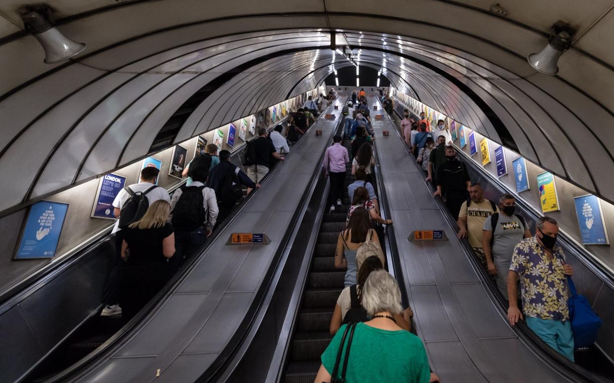 Commuters travel on the London Underground escalators - Wiktor Szymanowicz/Anadolu Agency