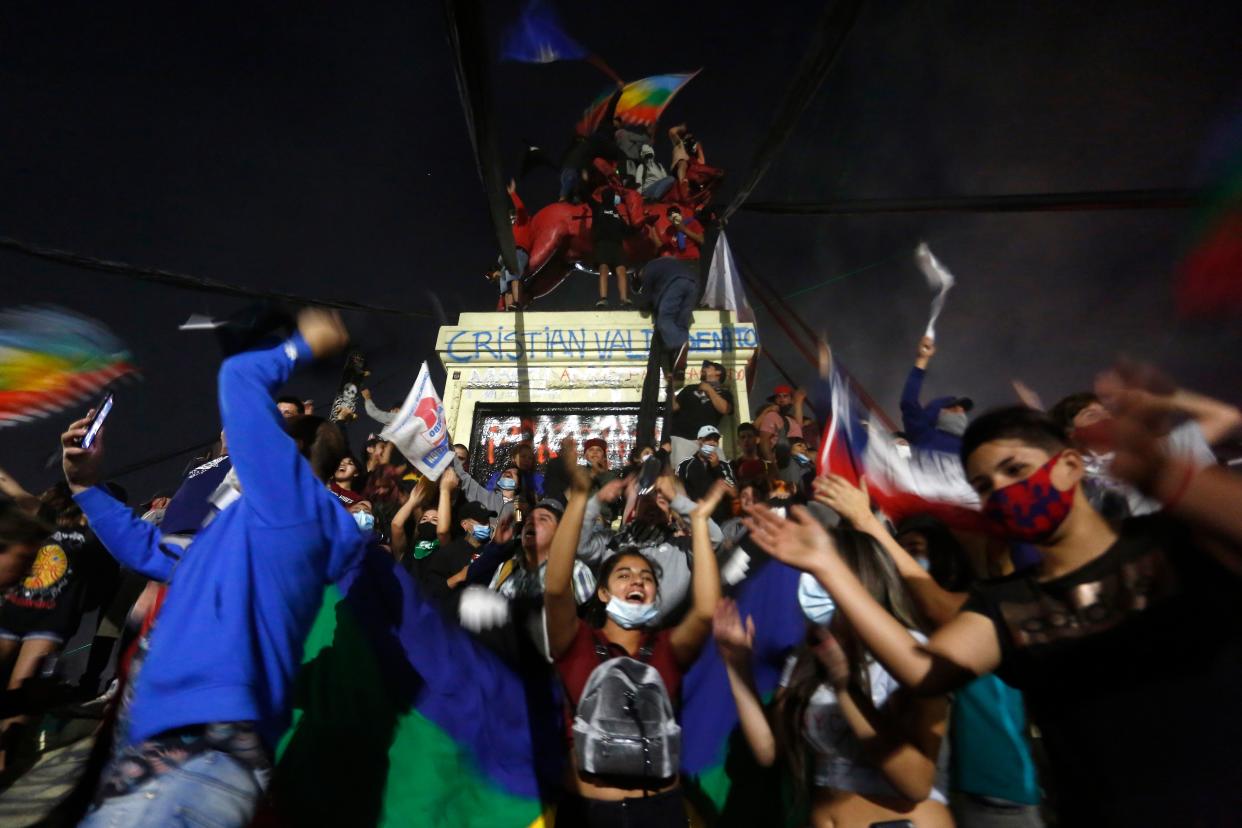 Chileans celebrate at the main square of Santiago as the country votes to rewrite dictatorial era constitution (Getty Images)