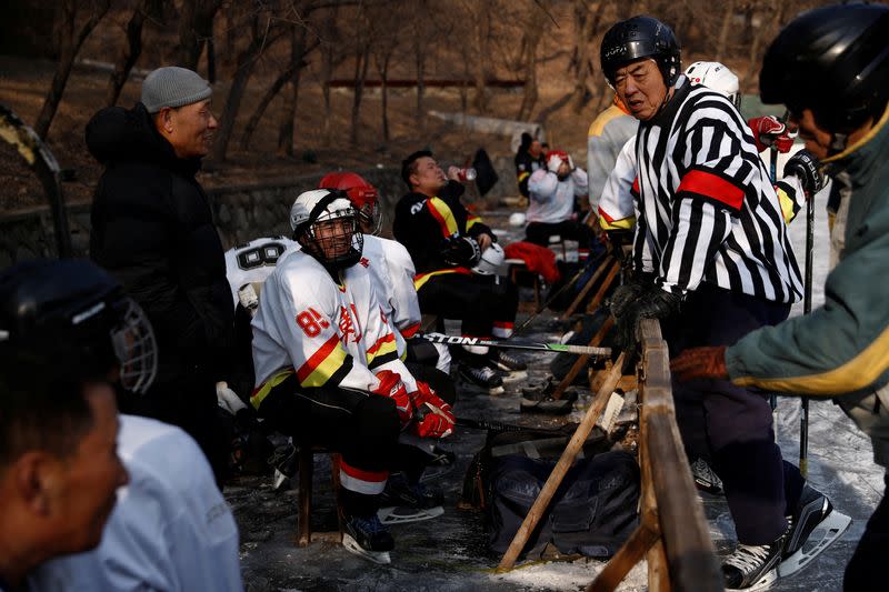 The Wider Image: On a frozen pond far from the Olympics, meet China's ice hockey veterans