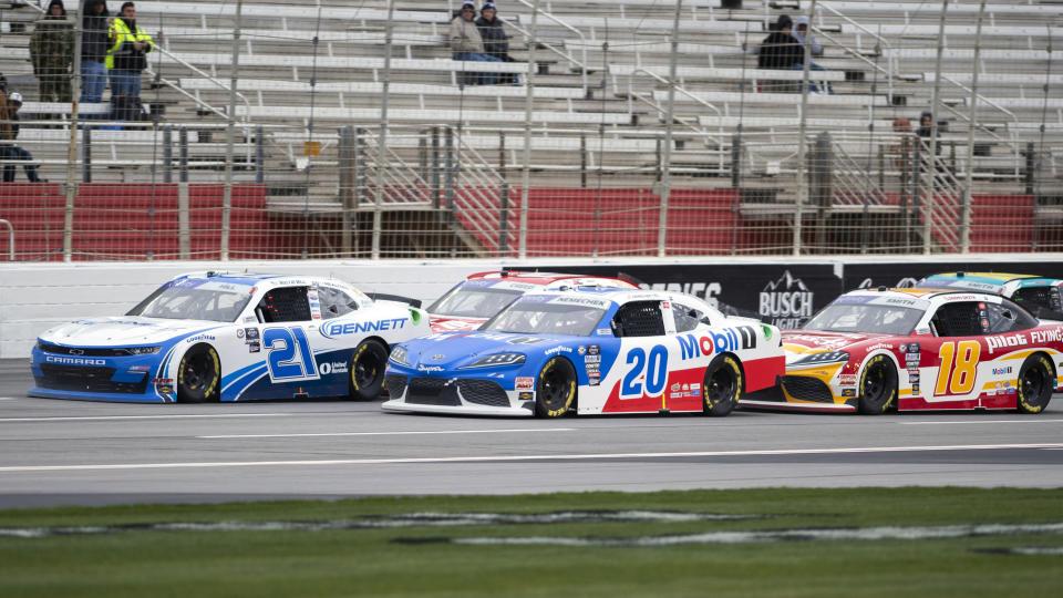 Austin Hill (21) leads at the start of the NASCAR Xfinity Series auto race at Atlanta Motor Speedway on Saturday, March 18, 2023, in Hampton, Ga. (AP Photo/Hakim Wright Sr.)