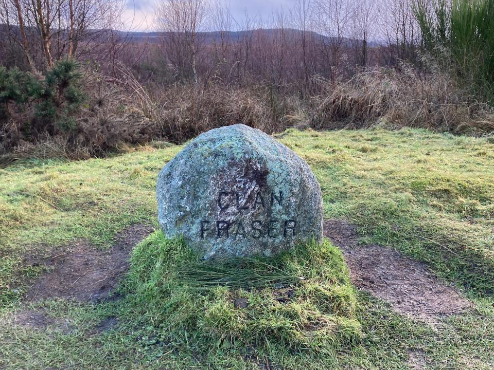 A stone that says "Clan Fraser" on Culloden Moor in Scotland.