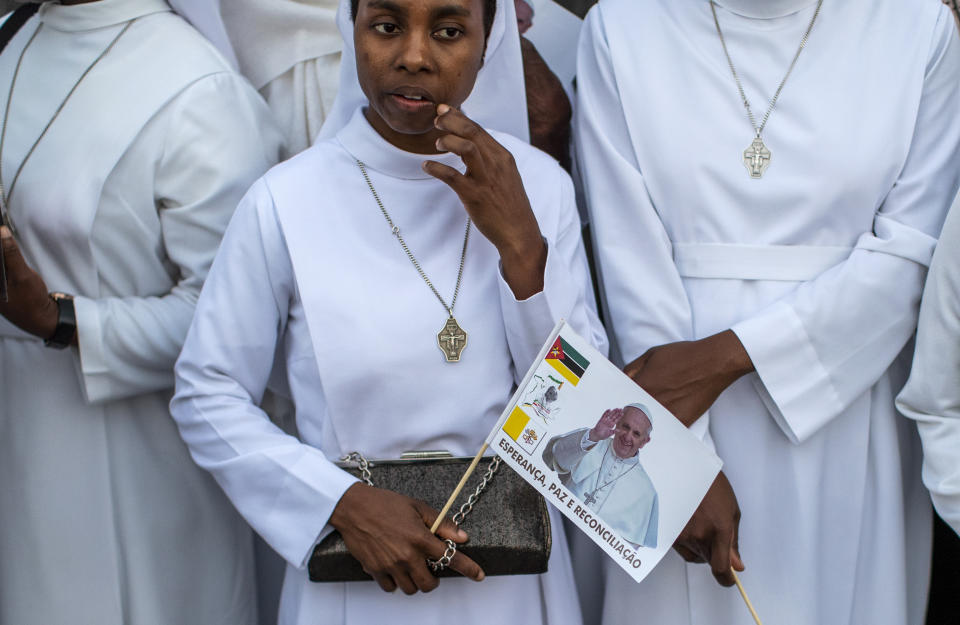 Sisters wait to see Pope Francis, ahead of his arrival at the Apostolic Nunciature in the capital Maputo, Mozambique Wednesday, Sept. 4, 2019. Pope Francis is opening a three-nation pilgrimage to southern Africa with a strategic visit to Mozambique, just weeks after the country's ruling party and armed opposition signed a new peace deal and weeks before national elections. (AP Photo/Ben Curtis)