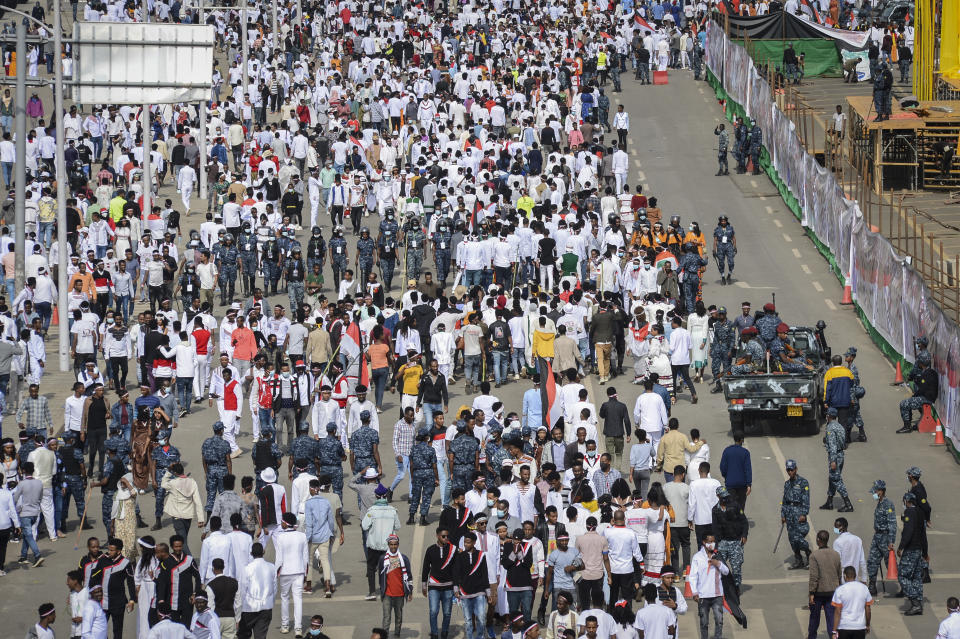 Oromos attend the annual Irreecha festival in the capital Addis Ababa, Ethiopia, Saturday, Oct. 2, 2021. Ethiopia's largest ethnic group, the Oromo, on Saturday celebrated the annual Thanksgiving festival of Irreecha, marking the end of winter where people thank God for the blessings of the past year and wish prosperity for the coming year. (AP Photo)