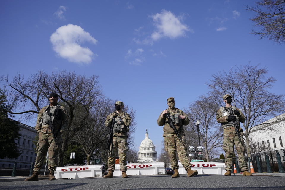 National Guard keep watch on the Capitol, Thursday, March 4, 2021, on Capitol Hill in Washington. Capitol Police say they have uncovered intelligence of a "possible plot" by a militia group to breach the U.S. Capitol on Thursday, nearly two months after a mob of supporters of then-President Donald Trump stormed the iconic building to try to stop Congress from certifying now-President Joe Biden's victory. (AP Photo/Jacquelyn Martin)