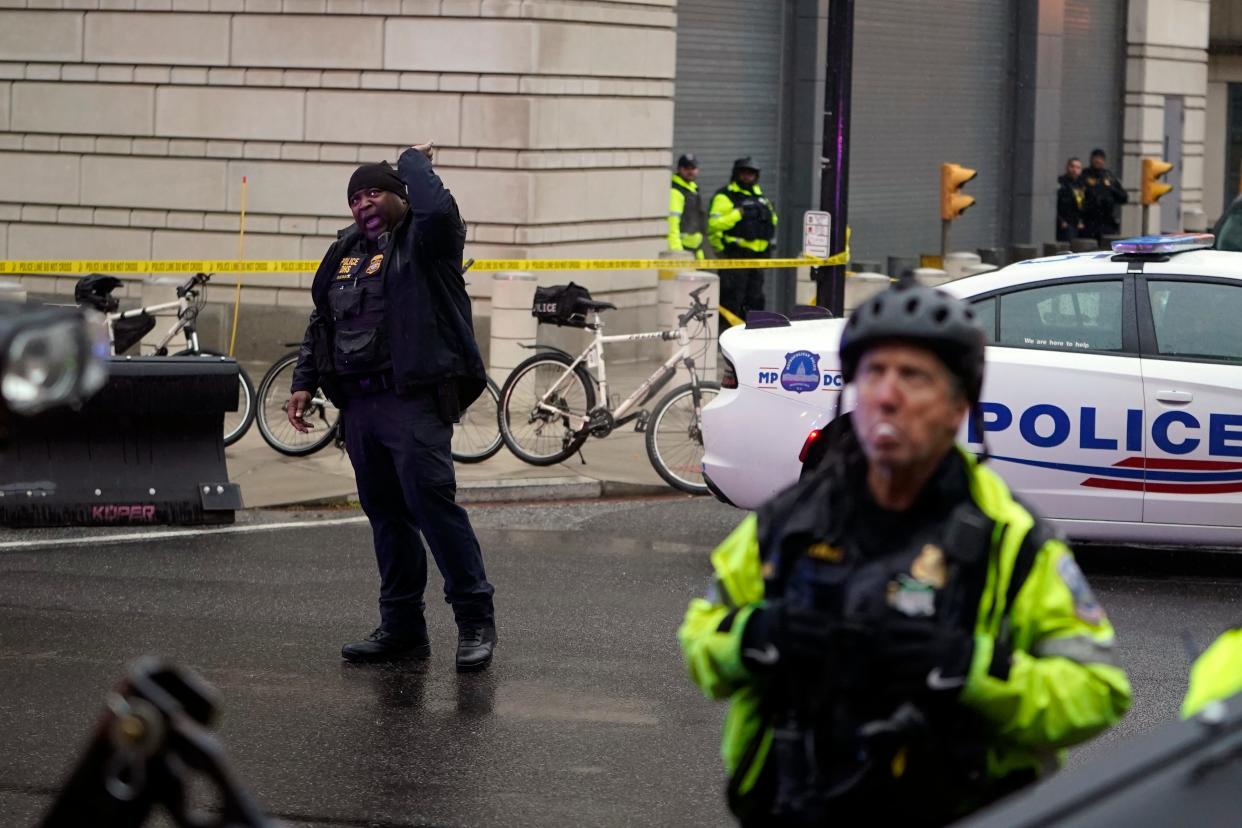 DC police stand outside as Former President Donald Trump arrives at the U.S. Circuit Court of Appeals for the District of Columbia on Jan. 9, 2024, to appeal on whether he is immune from prosecution on charges that he illegally tried to overturn the 2020 election in Washington.