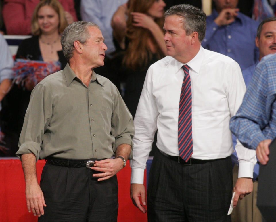 Then-President George W. Bush jokes with his brother, then-Florida Gov. Jeb Bush, on Monday, Nov. 6, 2006, in Pensacola, Fla., where Bush was drumming up support for local Republican candidates. (AP Photo/Mari Darr~Welch)