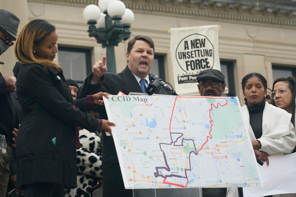 Protesters at the Mississippi Capitol in Jackson speak out on Jan. 31, 2023, against a bill that would create a separate court system in the proposed Capitol Complex Improvement District, CCID shown on the map.