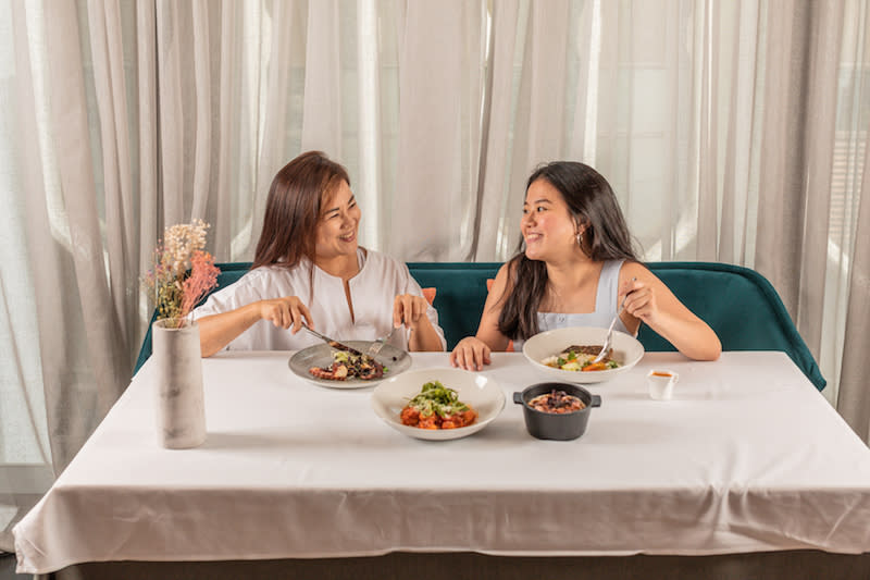 Picture of mother and daughter enjoying a meal