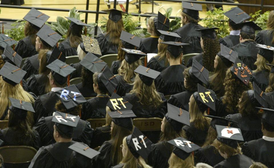 Local students are shown at a previous college graduation. Local students have earned honors from U.S. colleges and universities.