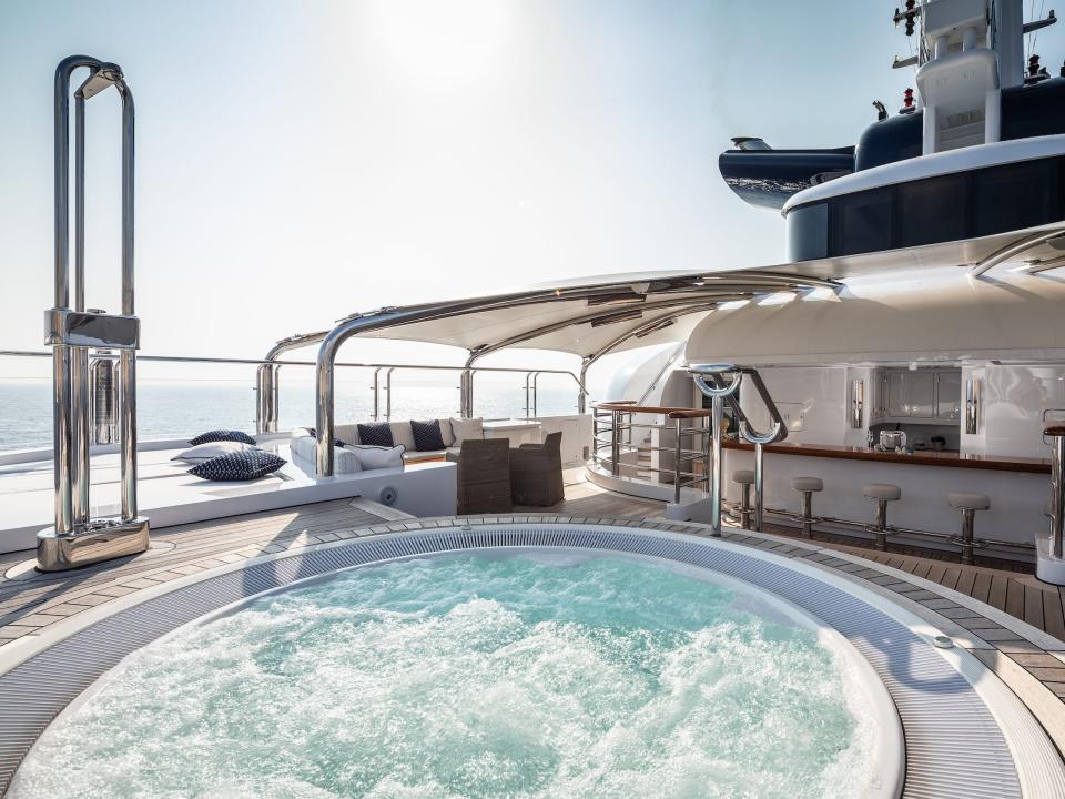 A round jacuzzi on an outdoor deck.