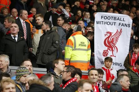 Football Soccer - Liverpool v Sunderland - Barclays Premier League - Anfield - 6/2/16 Liverpool chief executive Ian Ayre in the stands as fans hold up signs in protest against ticket prices Reuters / Phil Noble/ Livepic